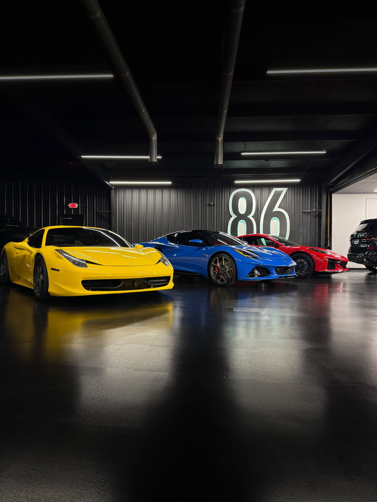 Exotic cars with paint protection film inside the 86 Auto Lab studio in Franklin